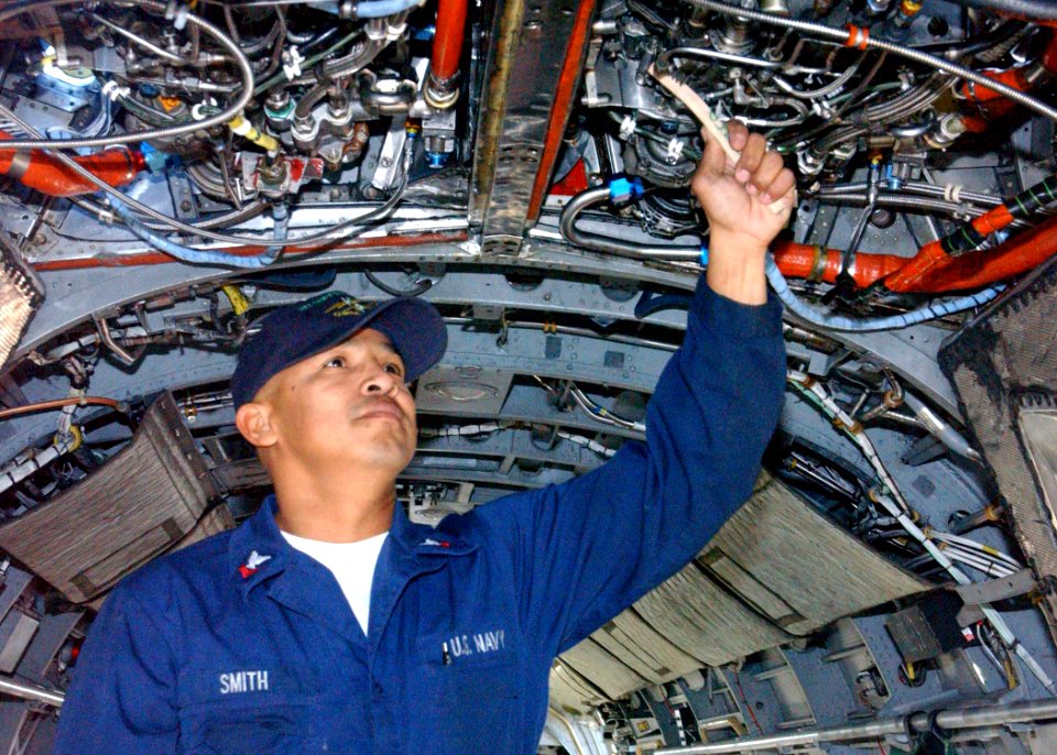 US Navy 021122-N-8156W-002 Aviation Machinist Mate 2nd Class Leonard Smith assigned to the Gunbearers of Helicopter Combat Support Squadron Eleven (HC-11)