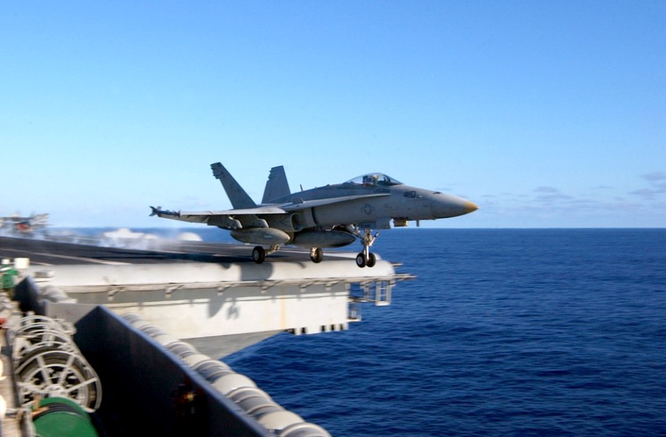 US Navy 021207-N-1810F-004 F-A-18C Hornet launches from one of four steam powered catapults on the ship's flight deck