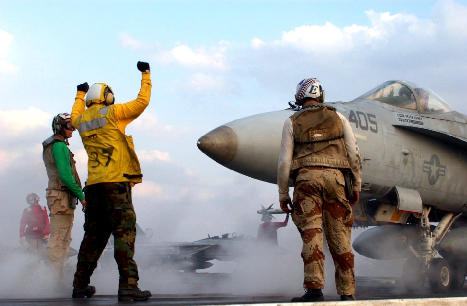 US Navy 021103-N-1810F-014 Hornet moves into position over one of four steam driven catapults