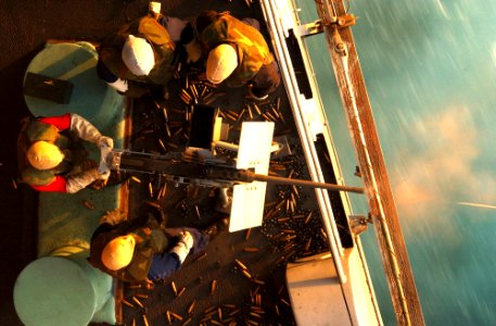 US Navy 021111-N-1810F-001 Aviation Ordnancemen conduct 50-caliber training on the fantail of the aircraft carrier