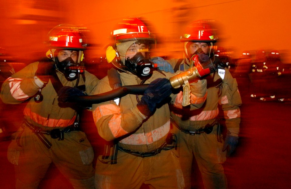 US Navy 021114-N-1328C-501 Firefighting team conducts training in the ship's hangar bay