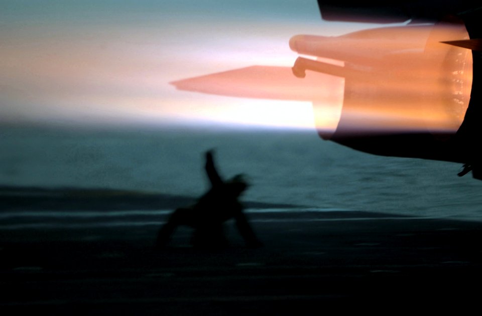 US Navy 021112-N-1810F-020 An F-14 Tomcat assigned to the Black Knights of Fighter Squadron One Five Four (VF-154) ignites its afterburners