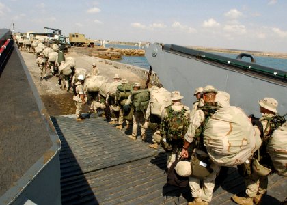 US Navy 021110-N-4374S-035 U.S. Marines assigned to the 24th Marine Expeditionary Unit (MEU) Special Operations Capable (SOC) disembark from a Landing Craft Utility (LCU) 1662 assigned to Assault Craft Unit Two (ACU-2)
