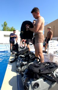 US Navy 021124-N-0331L-003 prepares the MK-16 re-breather unit for diving during a joint training exercise in the Central Command AOR
