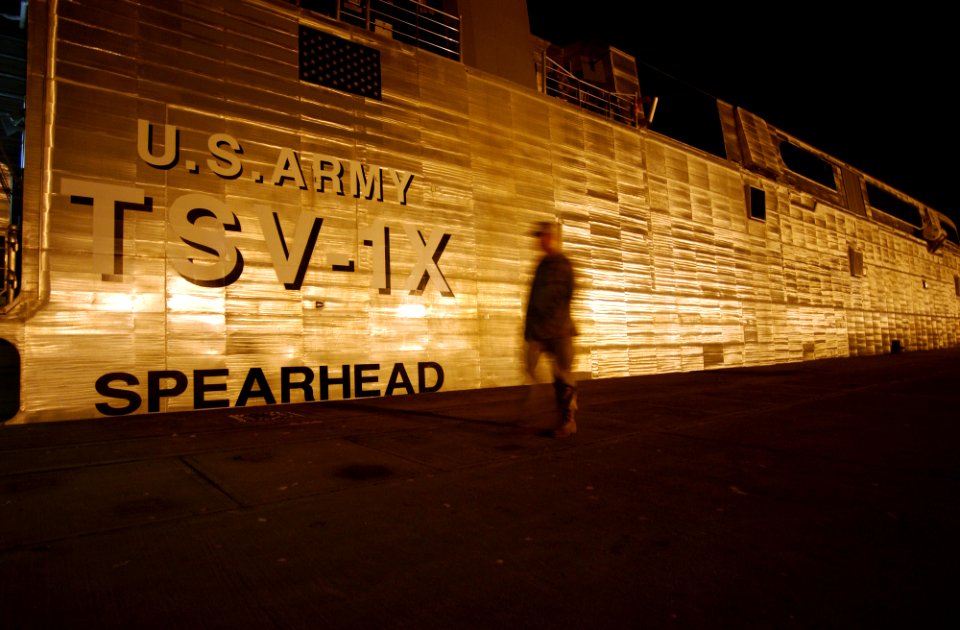 US Navy 030126-N-5319A-003 Chief Warrant Officer Four (CWO4) William R. Davis, skipper of United States Army Vessel (USAV) Theater Support Vessel Spearhead (TSV-1X), walks along side the ship while pier-side at a port within th