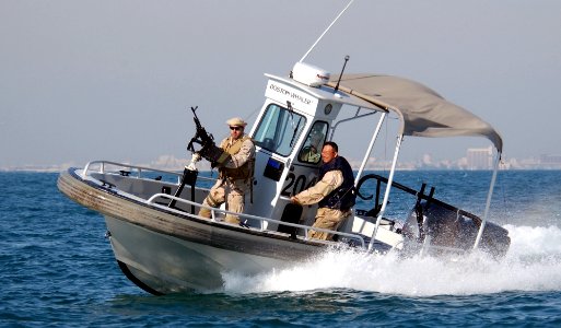 US Navy 030115-N-5319A-010 Navy Harbor Patrol, escorts the United States Army Vessel (USAV) Theatre Support Vessel, Spearhead (TSV-1X) as it departs from port