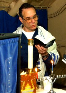 US Navy 021130-N-1159M-002 Jewish chaplain conducts services aboard the aircraft carrier USS Abraham Lincoln