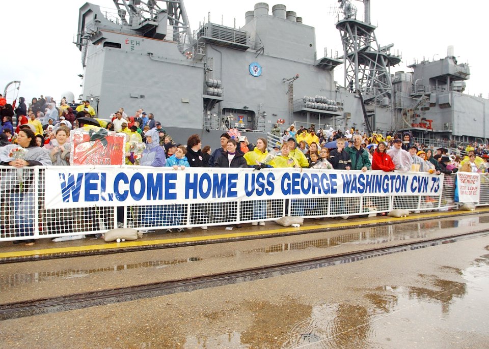 US Navy 021220-N-4374S-001 Family members and friends anxiously await the arrival of USS George Washington