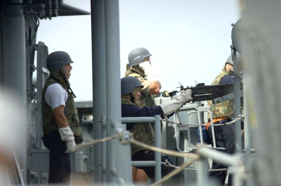 US Navy 021209-O-0000X-003 Spanish Sailors aboard the Santa Maria-class Frigate Navarra (F-85) man provide cover for boarding teams, during a hostile boarding of the North Korean vessel, So San