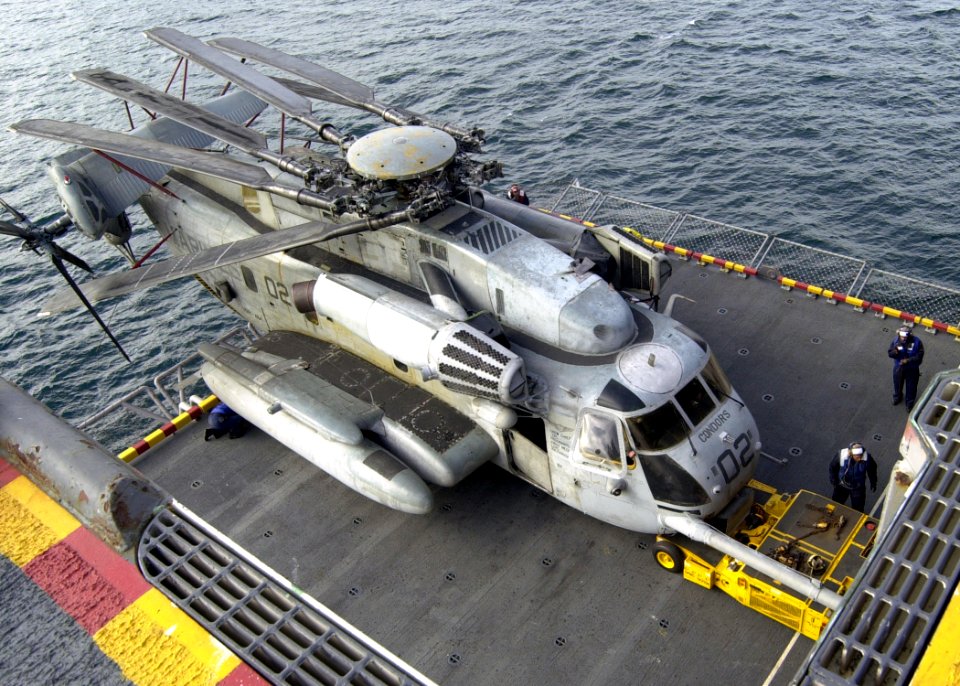 US Navy 030113-N-2972R-060 Air Department Sailors prepare to transport a CH-53 Sea Stallion helicopter