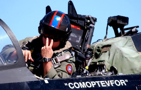 US Navy 021025-F-2034C-018 An F-14 Tomcat assigned to the Vampires of Air Test and Evaluation Squadron Nine (VX-9) signals to a maintainer prior to take off during exercise Cope Snapper 2002