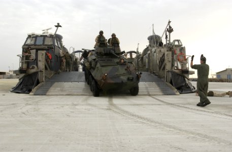 US Navy 030212-N-5319A-011 A Light Armored Vehicle (LAV) drives off of a Landing Craft Air Cushioned (LCAC)
