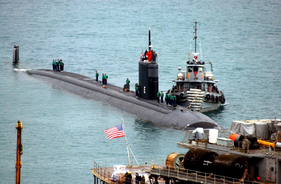 US Navy 030221-N-0780F-020 Los Angeles class submarine USS San Juan arrives for a port visit and prepares to be berthed next to submarine tender USS Emory S. Land