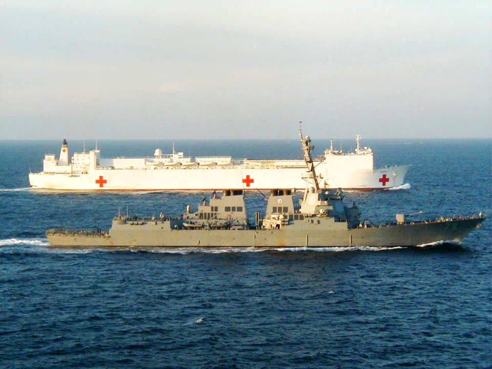 US Navy 030119-N-0000X-001 The guided missile destroyer USS Oscar Austin (DDG 79) escorts Military Sealift Command hospital ship USNS Comfort (T-AH 19)