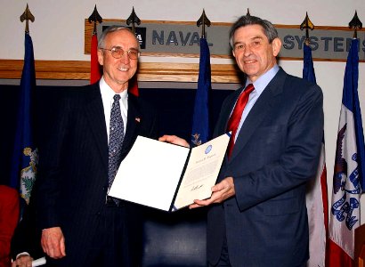 US Navy 030123-N-1928O-003 Paul Wolfowitz, Deputy Secretary of Defense, presents the Department of Defense Distinguished Public Service Award to the Honorable Gordon England, Secretary of the Navy (SECNAV)