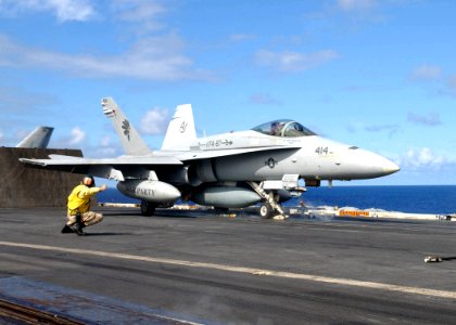 US Navy 030116-N-6895M-511 An F-A-18 Hornet is given the clear for launch sign