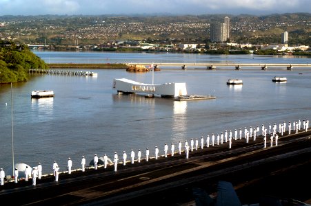 US Navy 030131-N-9273C-016 Sailors render honors to the Arizona Memorial as the aircraft carrier USS Carl Vinson (CVN 70) passes by to moor at Naval Station Pearl Harbor, Hawaii