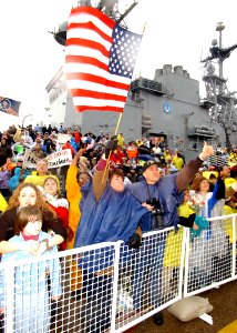 US Navy 021220-N-4374S-004 Family members and friends cheer on as they watch the arrival of USS George Washington (CVN 73)