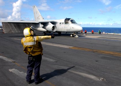 US Navy 030116-N-6895M-513 A plane director gives the thumbs up for launch to a S-3 Viking photo