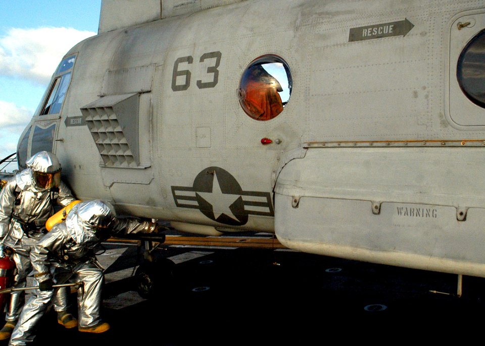 US Navy 030211-N-4048T-102 Sailors assigned to the Crash and Salvage Team aboard Kearsarge conducts a flight deck fire drill
