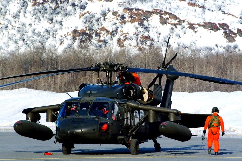 US Navy 030311-A-8380W-005 A UH-60 Black Hawk crew prepares for lift-off during Exercise Northern Edge 2003