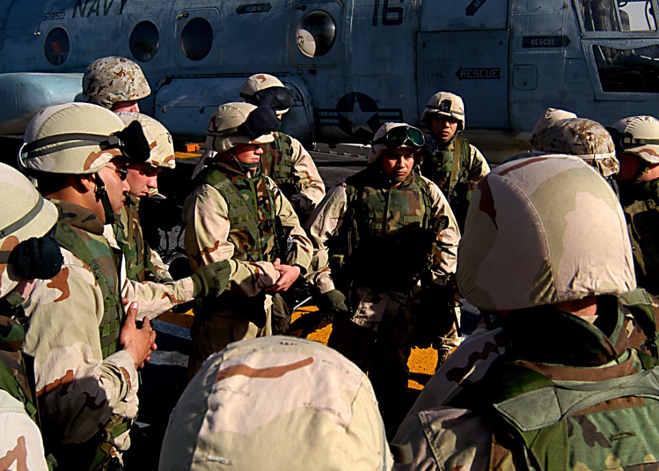 US Navy 030204-N-4048T-185 U.S. Marines assigned to the 2nd Marine Expeditionary Brigade are debriefed following a pre-aimed weapons calibration drill