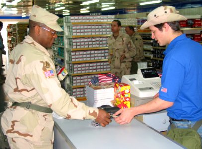 US Navy 030303-N-1050K-037 the first customer at the newly-opened Camp Patriot Army Air Force Exchange Service (AAFES) facility