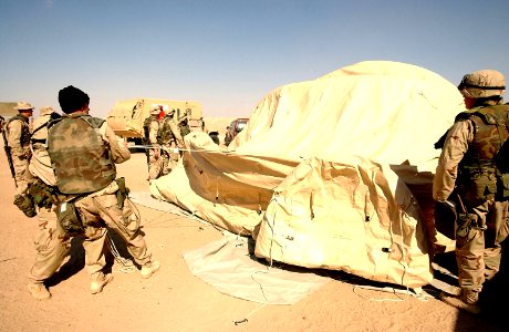 US Navy 030217-F-8362B-028 Sailors and Marines assigned to the 1st and 2nd Force Services Support Group (FSSG) assemble a Chemical Biological Protective Shelter (CBPS) during a training session