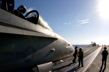 US Navy 030217-N-1810F-004 An F-A-18C Hornet sits ready on catapult three, one of four steam-powered catapults aboard the aircraft carrier USS Kitty Hawk (CV 63)