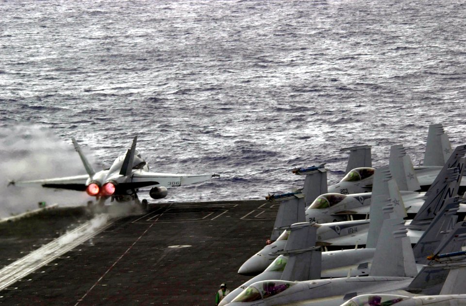 US Navy 030309-N-2385R-001 An FA-18A Hornet launches from the flight deck