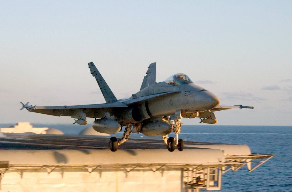 US Navy 021207-N-1810F-003 F-A-18C Hornet launches from one of four steam powered catapults on the ship's flight deck