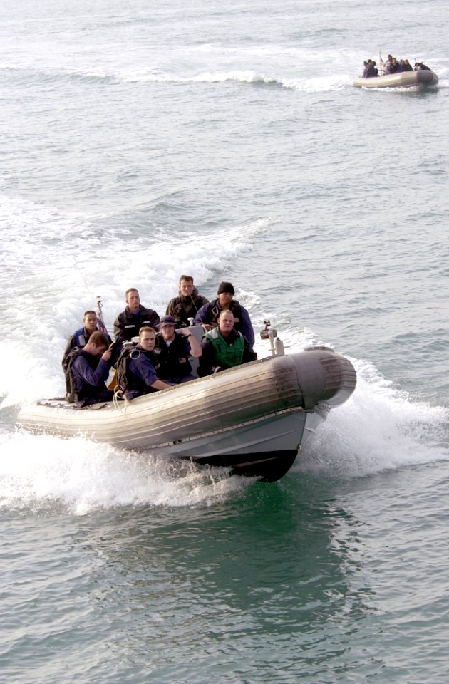 US Navy 021207-N-5319A-006 The Vessel Boarding Search and Seizure (VBSS) team cruises along side USS Fletcher after Maritime Interdiction Operations (MIO)