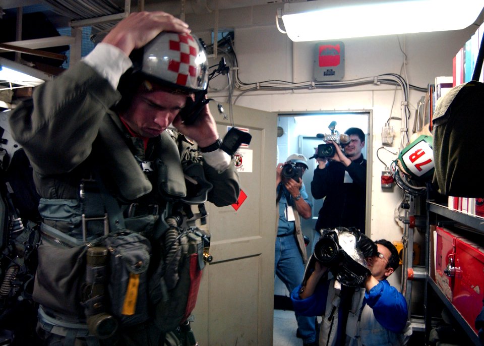 US Navy 030321-N-7781D-084 Embedded Media aboard the aircraft carrier USS Harry S. Truman (CVN 75) document a U.S. Naval Aviator assigned to the