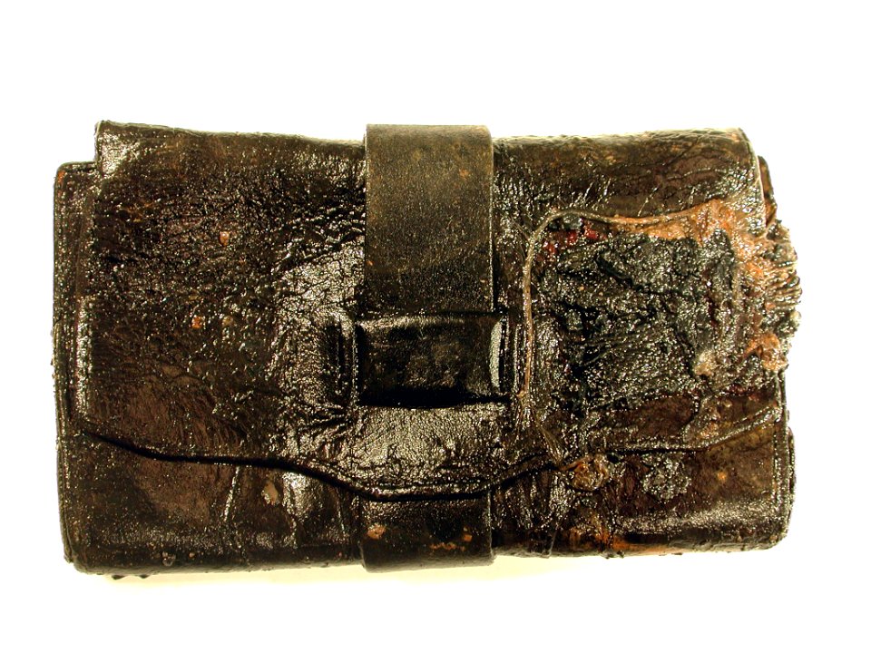US Navy 030221-O-0000O-001 Civil War-era wallet was discovered by Naval Historical Center archeologists during their excavation of the Confederate submarine H.L. Hunley
