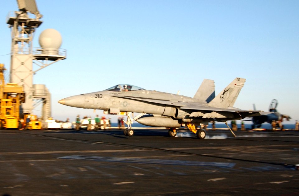 US Navy 030228-N-1810F-007 F-A-18 Hornet makes arrested landing aboard USS Kitty Hawk CV 63