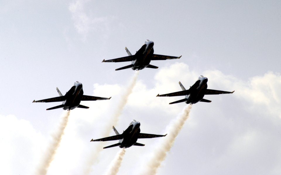 US Navy 040514-N-0295M-059 F-A-18A Hornets assigned to the Blue Angels, perform a four aircraft formation fly-by