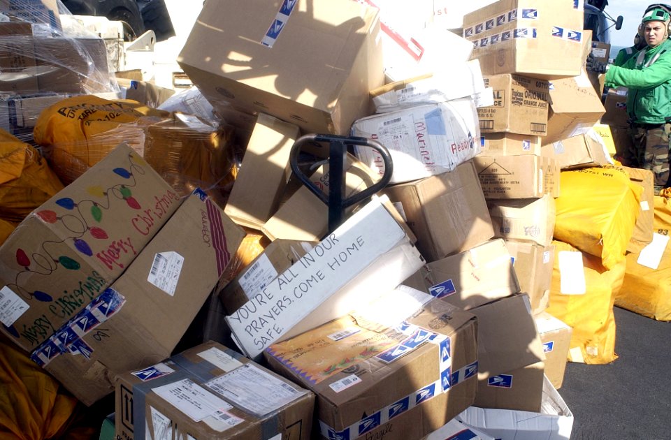 US Navy 021225-N-4142G-020 Mail for Sailors is staged on the ship's flight deck on Christmas day in preparation for dissemination to the crew