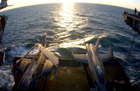 US Navy 030228-N-1810F-013 An EA-6B and an F-A-18C are raised to the flight deck on one of four aircraft elevators aboard USS Kitty Hawk (CV 63)