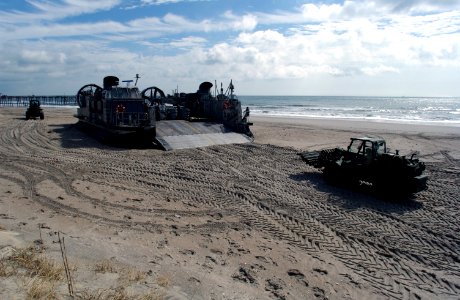 US Navy 030305-N-3642E-019 A Landing Craft Air Cushion (LCAC) assigned to Assault Craft Unit Four is loaded with equipment from the 26th Marine Expeditionary Unit (26th MEU) to be transported aboard USS Iwo Jima (LHD 7)