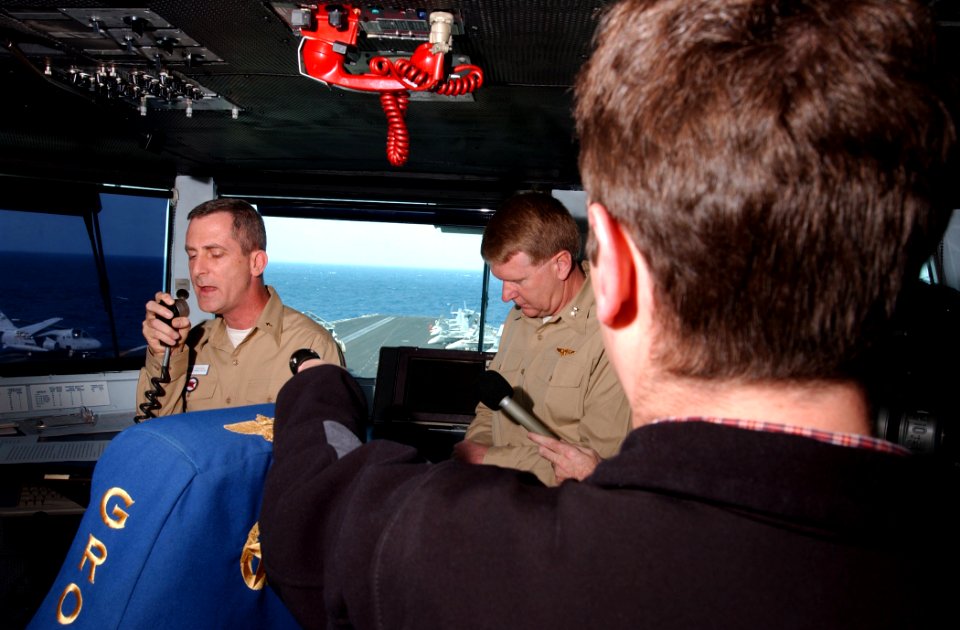 US Navy 030320-N-7781D-018 Cmdr. Doyle W. Dunn, ship's Chaplain, leads Sailors and Marines in a prayer following news that the United States officially commenced combat over Iraq