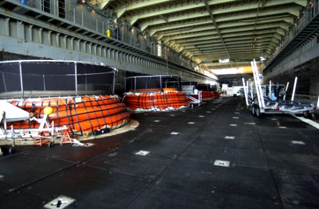 US Navy 030317-N-5319A-002 Shipboard Inflatable pools setup by Commander Task Unit 55.4.3 (CTU-55.4.3) hold nine Bottle Nose Dolphins