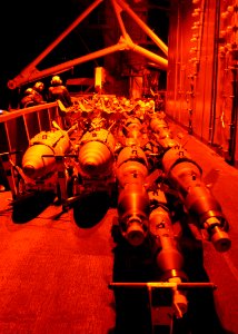 US Navy 030322-N-2410G-511 Weapons stand ready for Carrier Air Wing Eight (CVW-8) aircraft on the flight deck aboard the aircraft carrier USS Theodore Roosevelt (CVN 71)