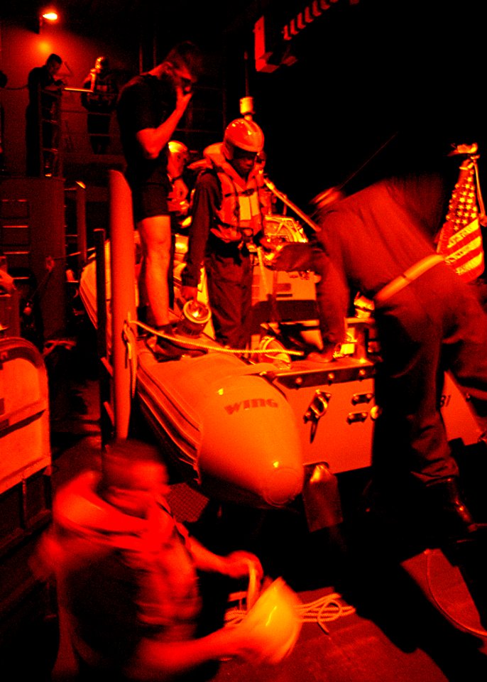 US Navy 030323-N-4048T-027 Deck Department personnel prepare to launch a Rigid Hull Inflatable Boat (RHIB) from aboard USS Kearsarge (LHD 3)