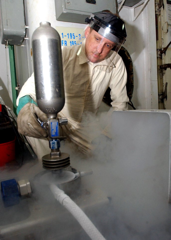US Navy 030220-N-5786V-501 a liquid oxygen (LOX) sample from the cryogenics plant to check for purity