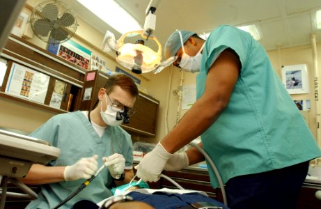 US Navy 030124-N-1328C-510 Navy dentist treats patients aboard ship photo
