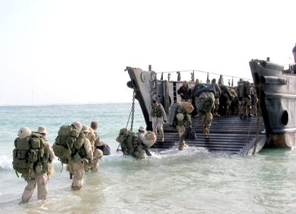 US Navy 030226-N-1050K-023 Royal Marines from the 40th Commando unit load onto a Landing Craft Utility (LCU) following intensive training in the Kuwaiti Desert photo