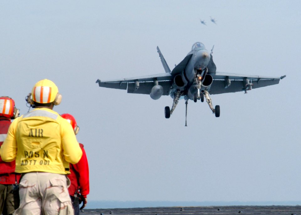 US Navy 030310-N-5786V-501 An F-A-18C Hornet approaches the flight deck of USS Theodore Roosevelt (CVN 71) for a landing