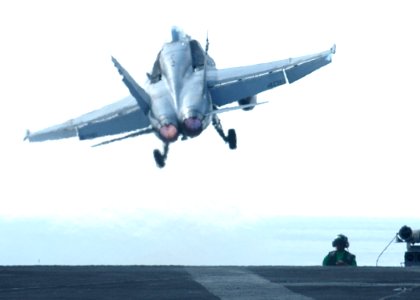 US Navy 030310-N-5786V-504 A F-A-18C Hornet assigned to the Golden Warriors of Strike Fighter Squadron Eight Seven (VFA-87) launches from the flight deck of USS Theodore Roosevelt (CVN 71)