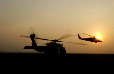 US Navy 050925-C-9767K-119 Two U.S. Coast Guard HH-60 Jayhawk helicopters take off shortly after Hurricane Rita made landfall