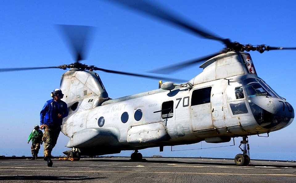 US Navy 030303-C-9409S-003 The flight deck crew aboard the amphibious dock landing ship USS Comstock (LSD 45) readies a CH-46 Sea Knight for departure